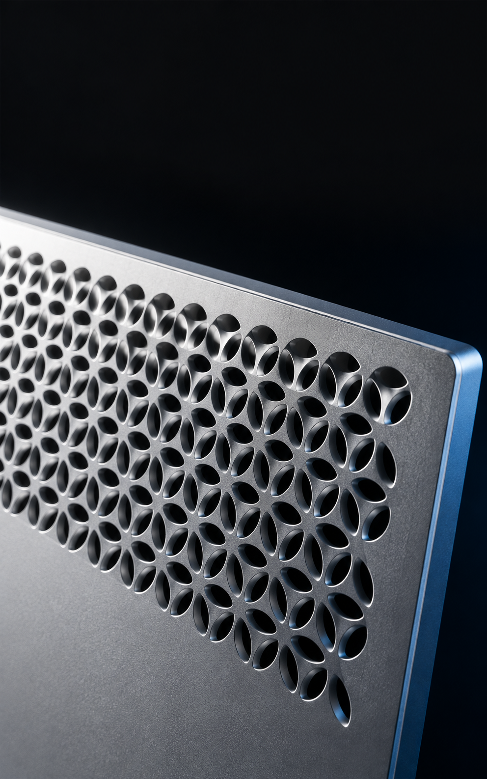 Macro artwork of a silver aluminum monitor enclosure and perforated rear detail