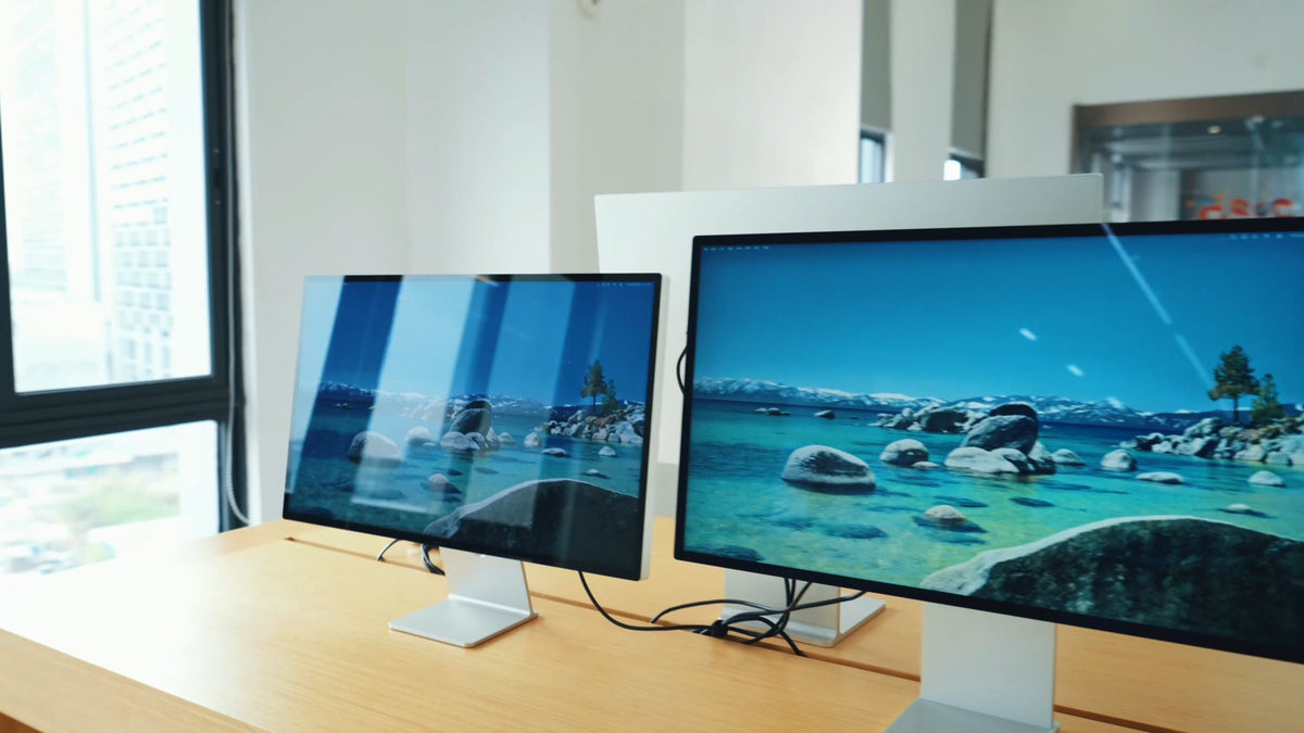 Early KUYCON monitors being viewed together in a bright workspace